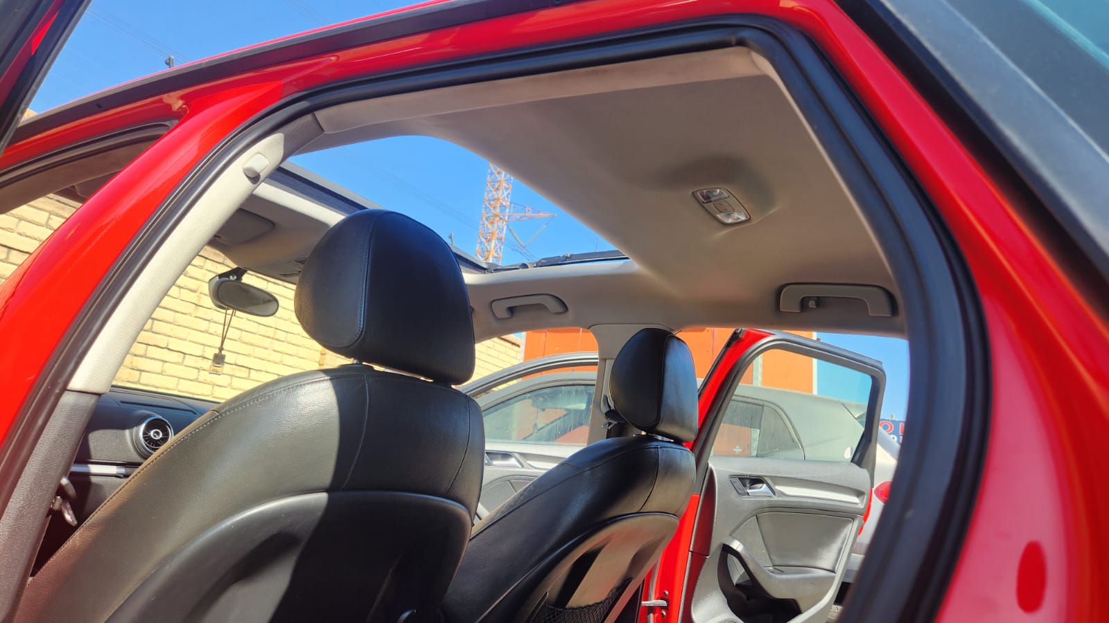Clean dry vehicle roof lining and open sunroof